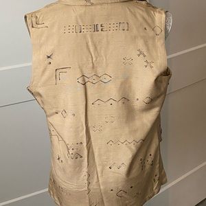This tan vest looks great with anything.
